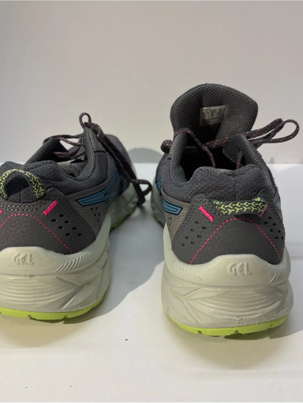 ASICS woman Gray Running Shoe with Blue Logo and Neon Accents  size 9